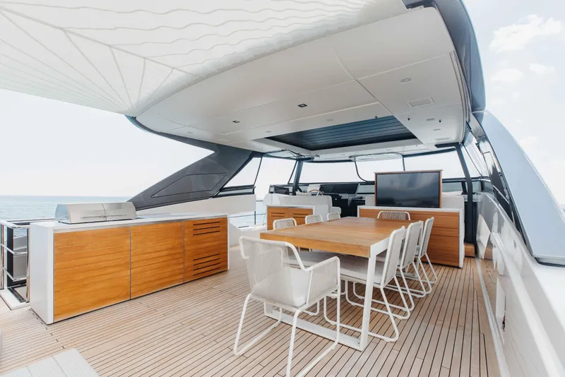 Slide: The Image of Luxurious 2024 Sanlorenzo SL90A yacht deck with dining area and modern amenities. - 68