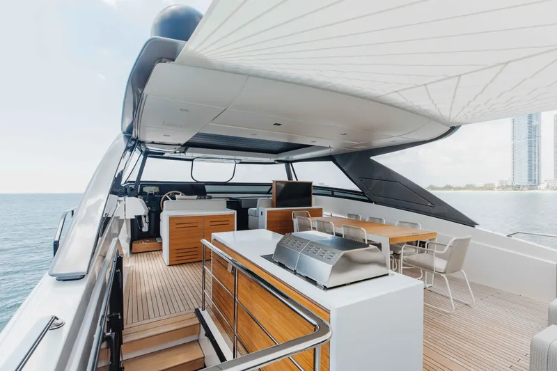 Slide: The Image of Luxurious 2024 Sanlorenzo SL90A yacht deck with modern outdoor dining and grill area. - 69