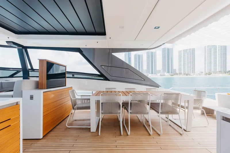 Slide: The Image of Luxurious 2024 Sanlorenzo SL90A yacht deck with modern dining area and ocean view. - 75
