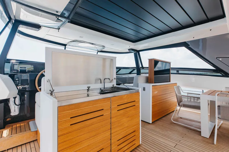 Slide: The Image of Luxurious 2024 Sanlorenzo SL90A yacht interior with modern kitchen and dining area. - 76