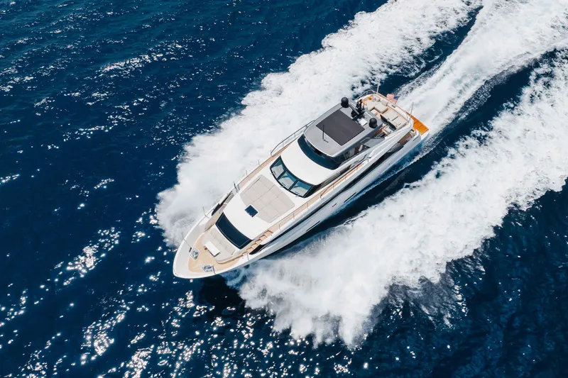 Slide: The Image of 2024 Sanlorenzo SL90A yacht cruising on open blue sea, aerial view. - 8