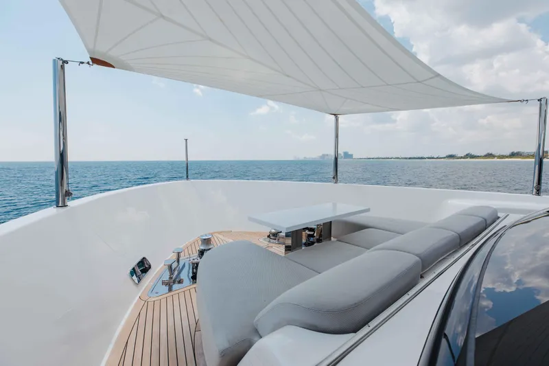 Slide: The Image of Luxurious 2024 Sanlorenzo SL90A yacht deck with seating, table, and ocean view. - 82