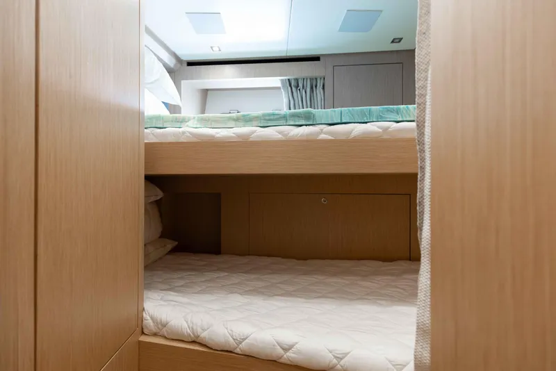 Slide: The Image of 2024 Sanlorenzo SL90A yacht interior with modern bunk beds and wooden finish. - 87
