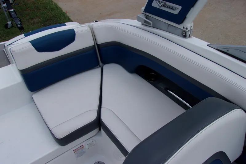 Slide: The Image of 2016 Chaparral Vortex 203 VR boat interior with blue and white seating. - 11