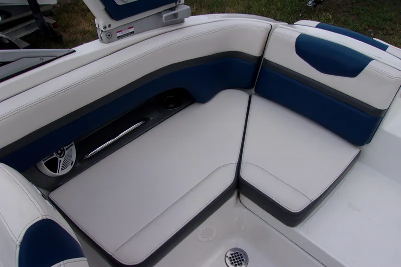 Slide: The Image of 2016 Chaparral Vortex 203 VR boat interior seating with blue and white upholstery. - 12