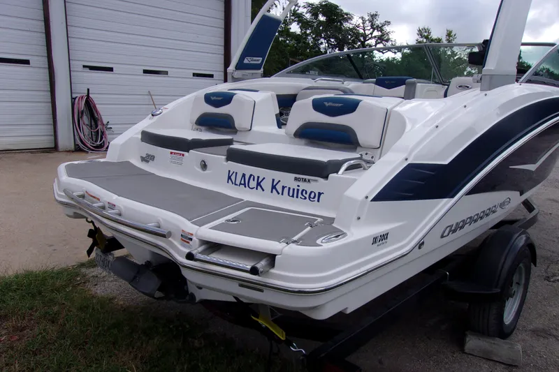 Slide: The Image of 2016 Chaparral Vortex 203 VR boat on trailer, rear view, white and blue design. - 3
