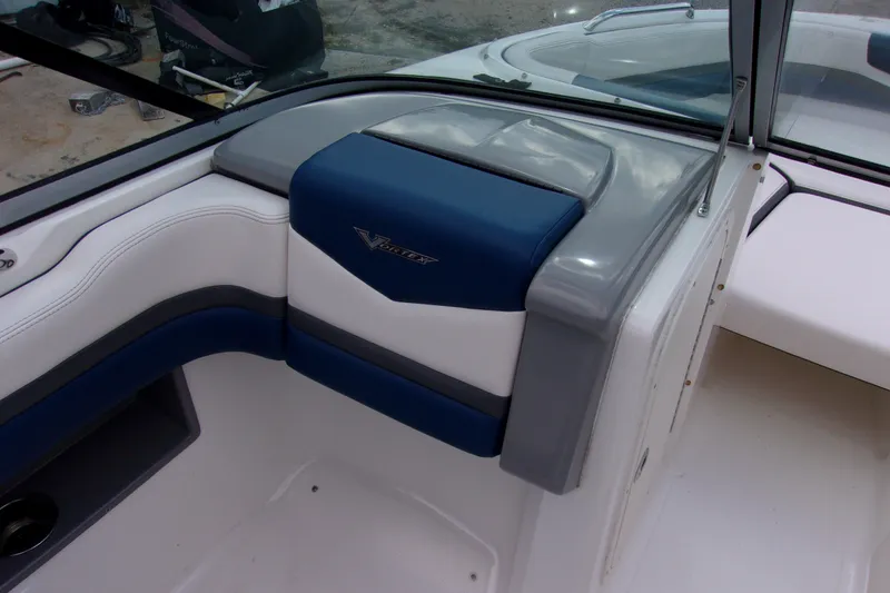 Slide: The Image of 2016 Chaparral Vortex 203 VR boat interior with blue and gray seating. - 8