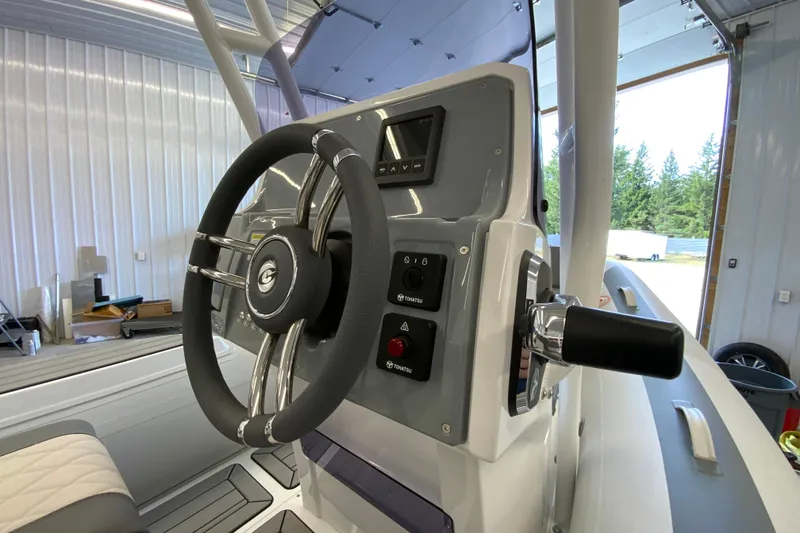 Slide: The Image of Steering console of 2026 Gala V500 boat in a garage setting. - 11