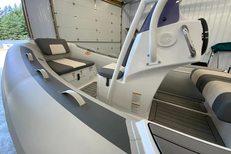 Slide: The Image of 2026 Gala V500 boat interior with modern seating and controls in a garage setting. - 5
