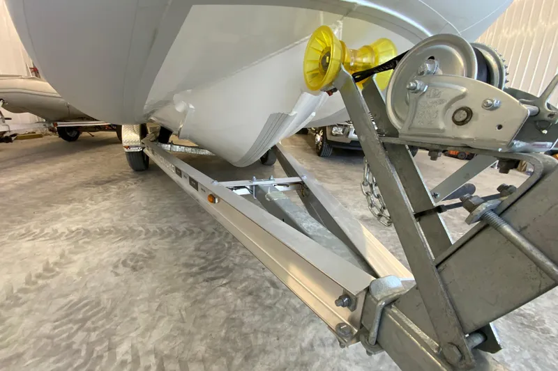 Slide: The Image of 2026 Gala V500 boat on trailer, close-up of hull and winch system. - 7