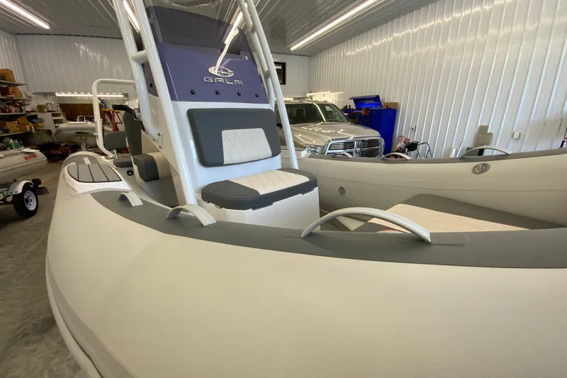 Slide: The Image of 2026 Gala V500 boat in a garage, featuring sleek design and modern seating. - 8