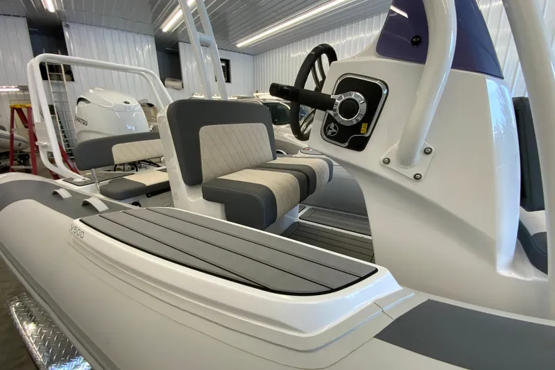 Slide: The Image of 2026 Gala V500 boat interior with modern seating and steering console. - 9