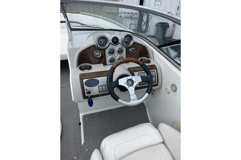 Slide: The Image of 2006 Formula 240 Bowrider dashboard with steering wheel and instrument panel. - 13
