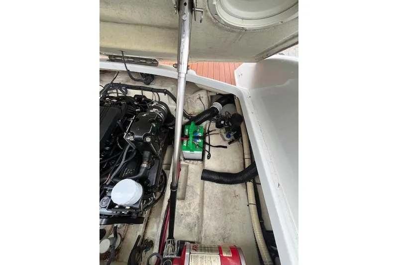 Slide: The Image of Engine compartment of a 2006 Formula 240 Bowrider boat, showing mechanical components. - 20