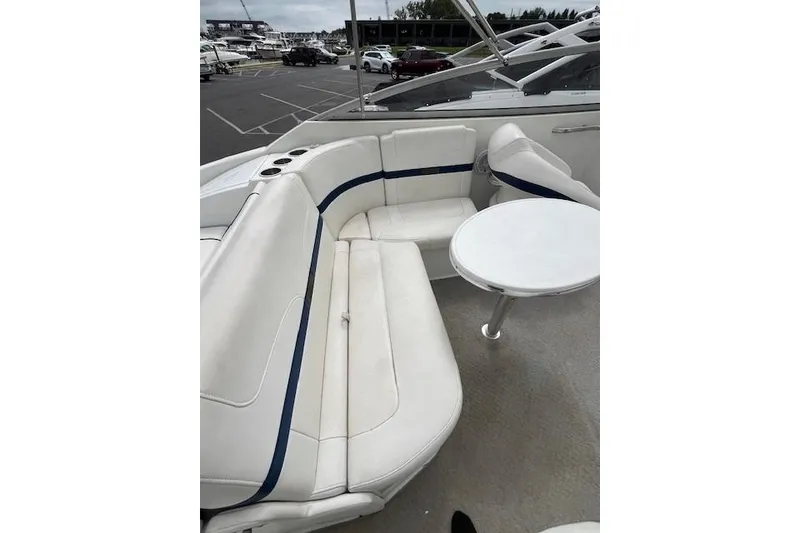 Slide: The Image of 2006 Formula 240 Bowrider interior with white seating and small round table. - 5
