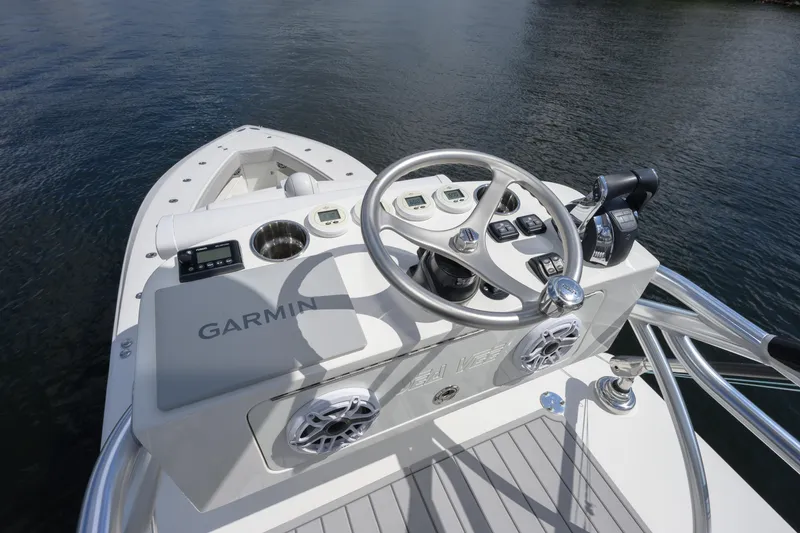 Slide: The Image of 2021 SeaVee 390Z boat helm with Garmin navigation system on calm water. - 10