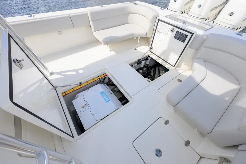 Slide: The Image of 2021 SeaVee 390Z boat interior with open storage compartments and seating area. - 5