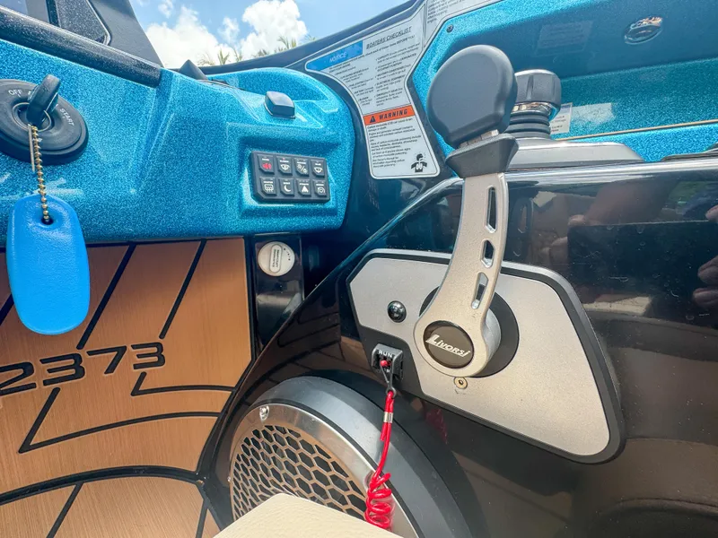 Slide: The Image of 2024 Varatti Z2373 boat dashboard with control panel and throttle lever. - 15