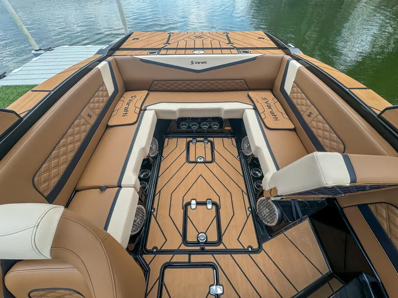 Slide: The Image of 2024 Varatti Z2373 boat interior with luxurious tan seating and wood accents. - 25