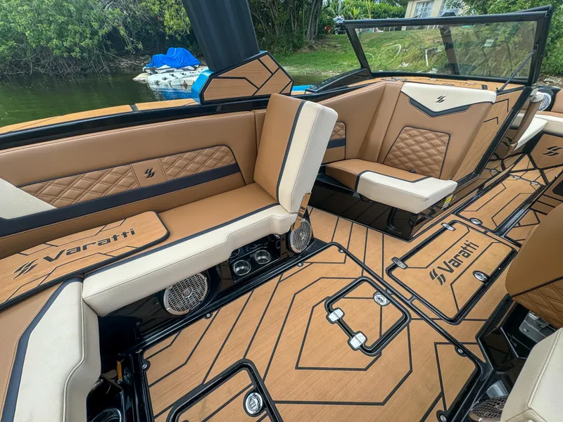 Slide: The Image of 2024 Varatti Z2373 boat interior with tan and black seating, stylish design, and premium finishes. - 26