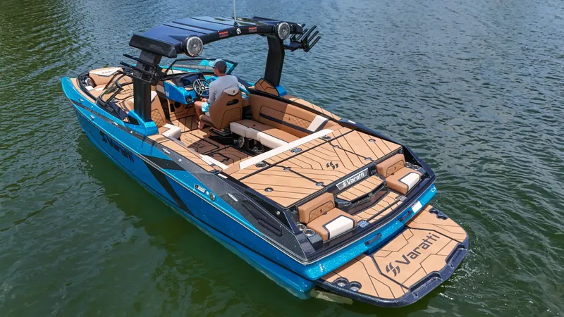 Slide: The Image of 2024 Varatti Z2373 boat cruising on a lake with a person at the helm. - 3
