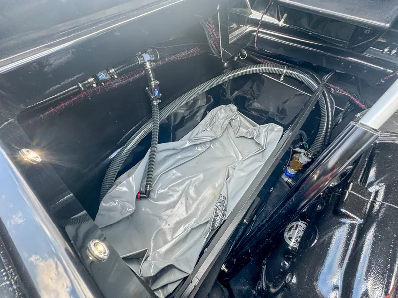 Slide: The Image of 2024 Varatti Z2373 boat interior compartment with hoses and equipment. - 41