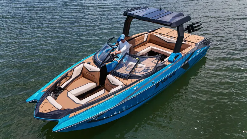 Slide: The Image of 2024 Varatti Z2373 boat on water, featuring sleek blue design and spacious seating. - 6