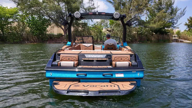Slide: The Image of 2024 Varatti Z2373 boat on a lake, rear view with lush greenery. - 8