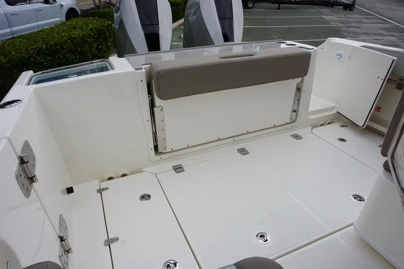 Slide: The Image of 2026 Boston Whaler 330 Vantage boat deck with seating and storage compartments. - 10