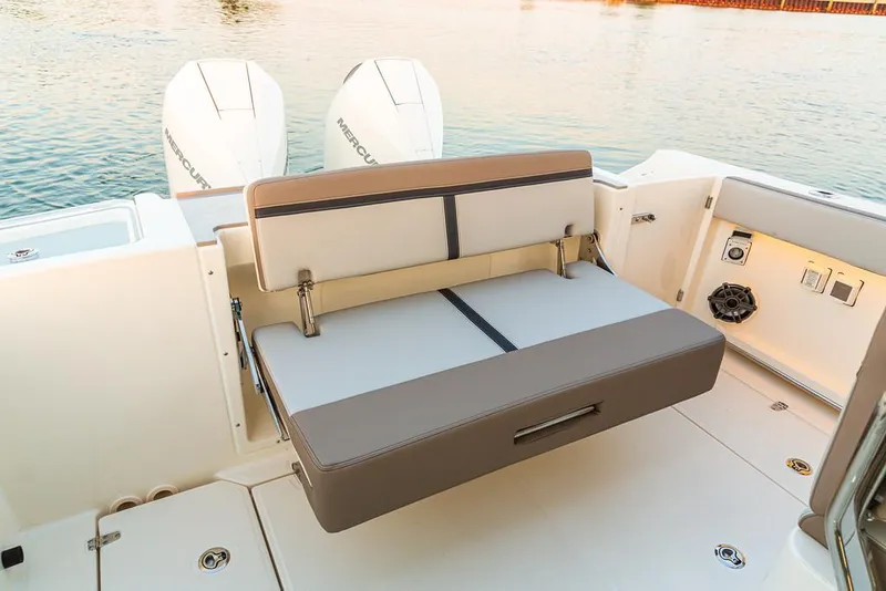 Slide: The Image of 2026 Boston Whaler 330 Vantage interior with luxurious seating and modern design. - 12