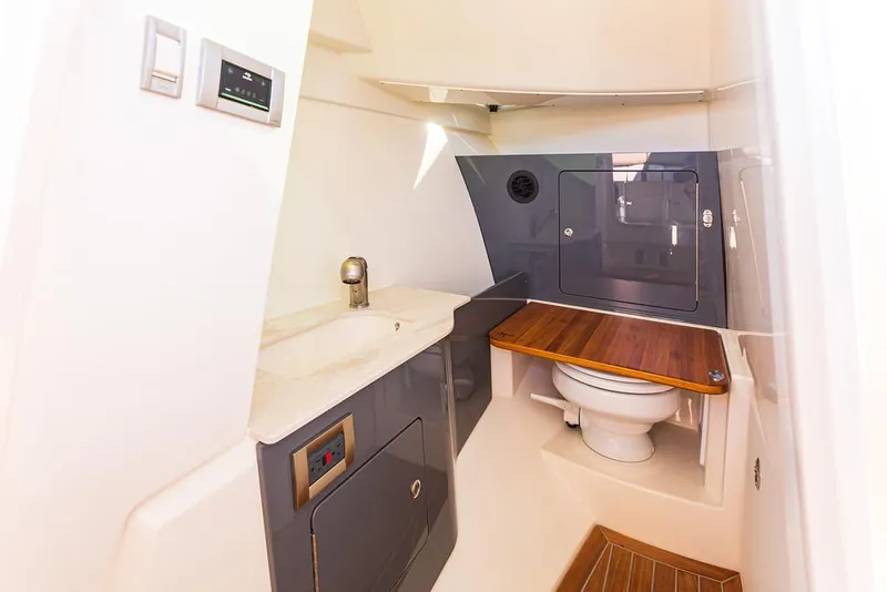 Slide: The Image of 2026 Boston Whaler 330 Vantage interior with luxurious seating and modern design. - 14