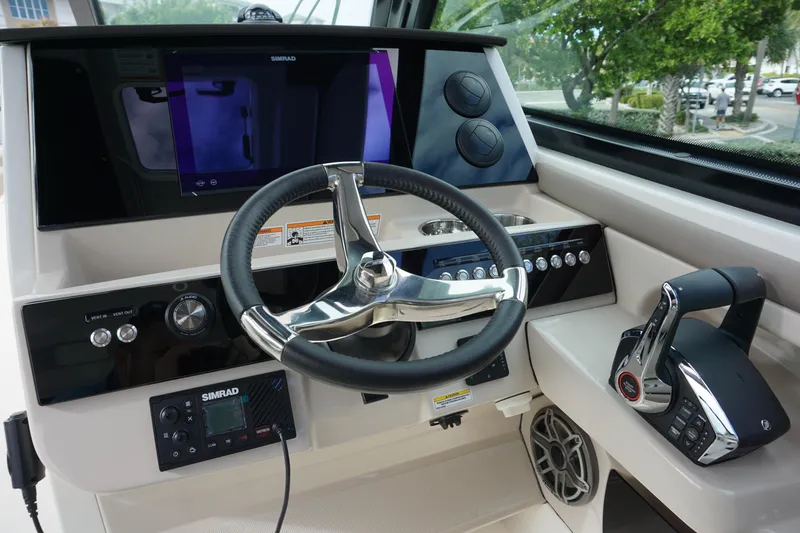 Slide: The Image of 2026 Boston Whaler 330 Vantage helm with advanced controls and navigation system. - 27