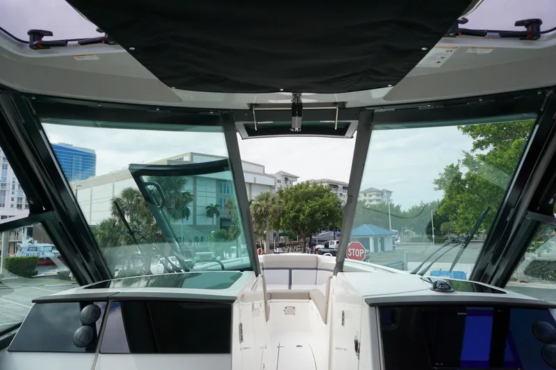 Slide: The Image of Interior view of 2026 Boston Whaler 330 Vantage boat, showcasing helm and windshield. - 34