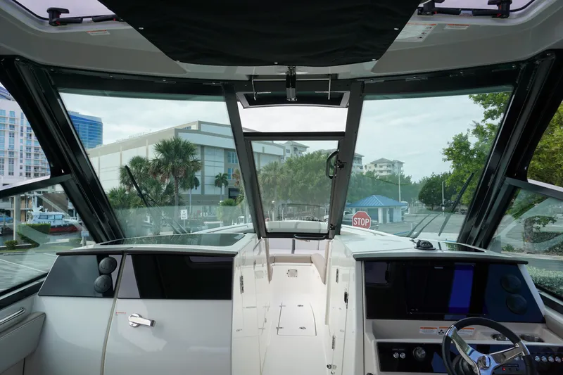 Slide: The Image of Interior view of 2026 Boston Whaler 330 Vantage boat cockpit with modern controls. - 35