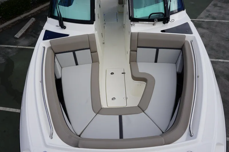 Slide: The Image of 2026 Boston Whaler 330 Vantage boat interior with cushioned seating and sleek design. - 38