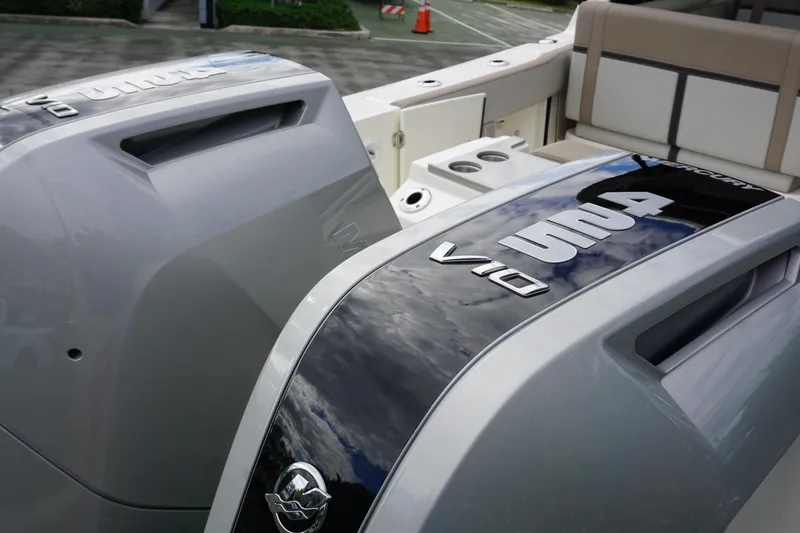 Slide: The Image of 2026 Boston Whaler 330 Vantage boat with dual V10 engines, sleek design. - 4