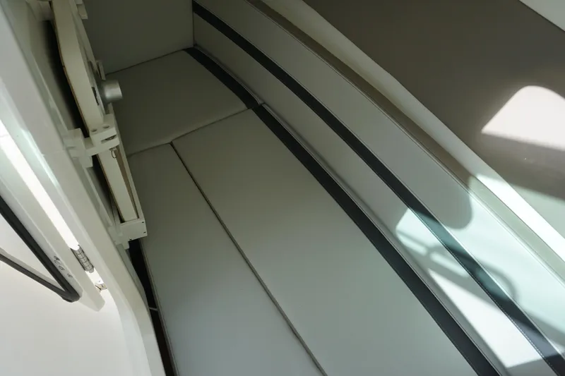 Slide: The Image of Interior cabin of 2026 Boston Whaler 330 Vantage, featuring sleek seating design. - 44