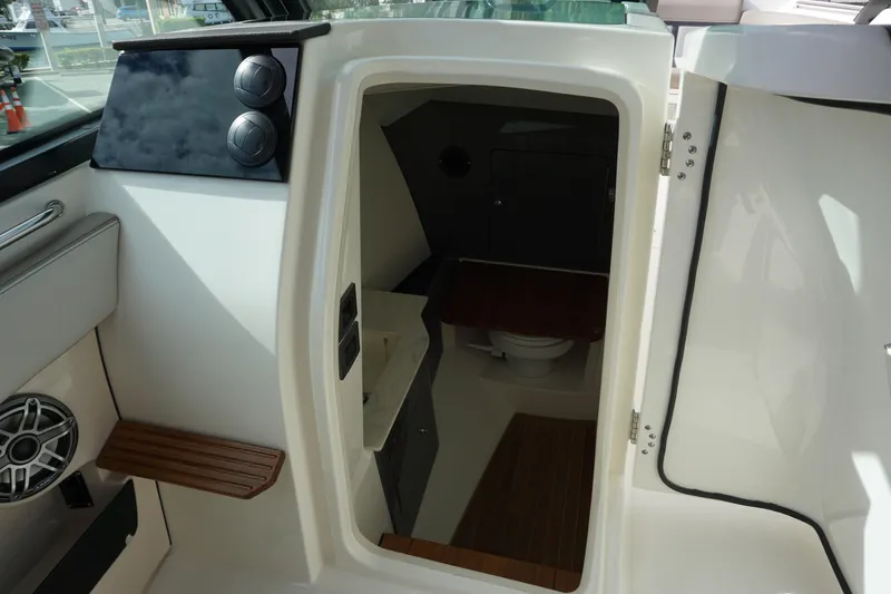 Slide: The Image of Interior view of 2026 Boston Whaler 330 Vantage boat cabin with seating and storage. - 45