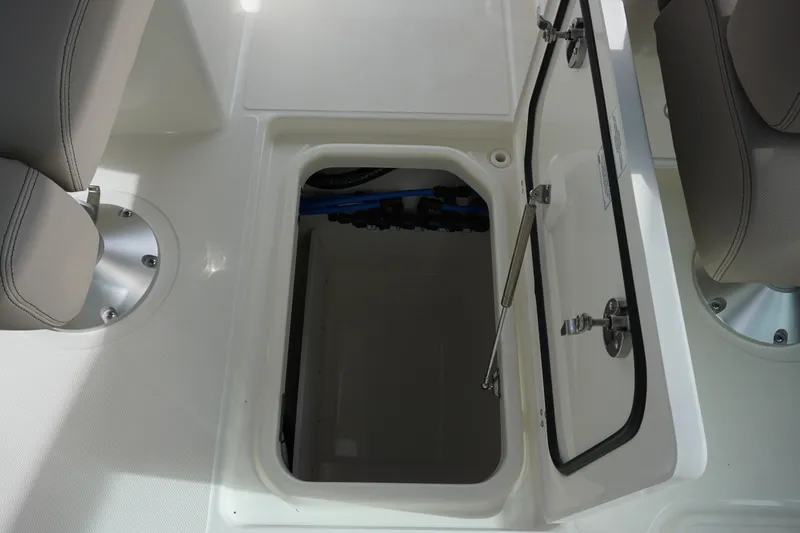 Slide: The Image of Open storage compartment on 2026 Boston Whaler 330 Vantage boat deck. - 49