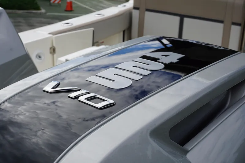 Slide: The Image of 2026 Boston Whaler 330 Vantage boat engine detail with V10 and Mercury branding. - 5