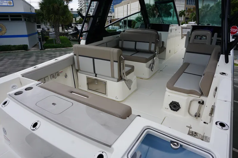 Slide: The Image of 2026 Boston Whaler 330 Vantage boat interior with seating and storage compartments. - 9