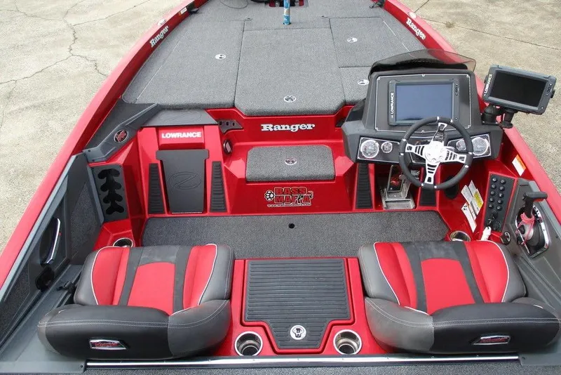 Slide: The Image of 2020 Ranger Z519 boat interior with red and black seats, advanced dashboard, and Lowrance electronics. - 11