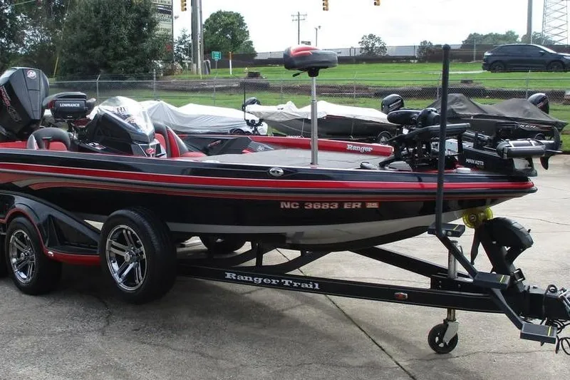 Slide: The Image of 2020 Ranger Z519 boat on trailer, black and red design, parked outdoors. - 6