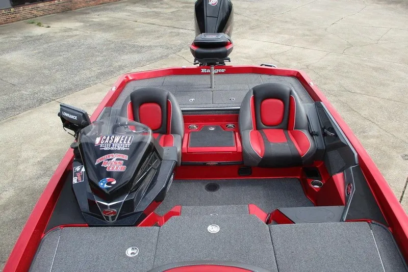 Slide: The Image of 2020 Ranger Z519 boat interior with red and black seating, Lowrance electronics, and Caswell branding. - 8