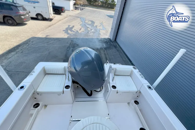 Slide: The Image of 2013 Grady-White Fisherman 209 boat with Yamaha outboard motor, parked near garage. - 12