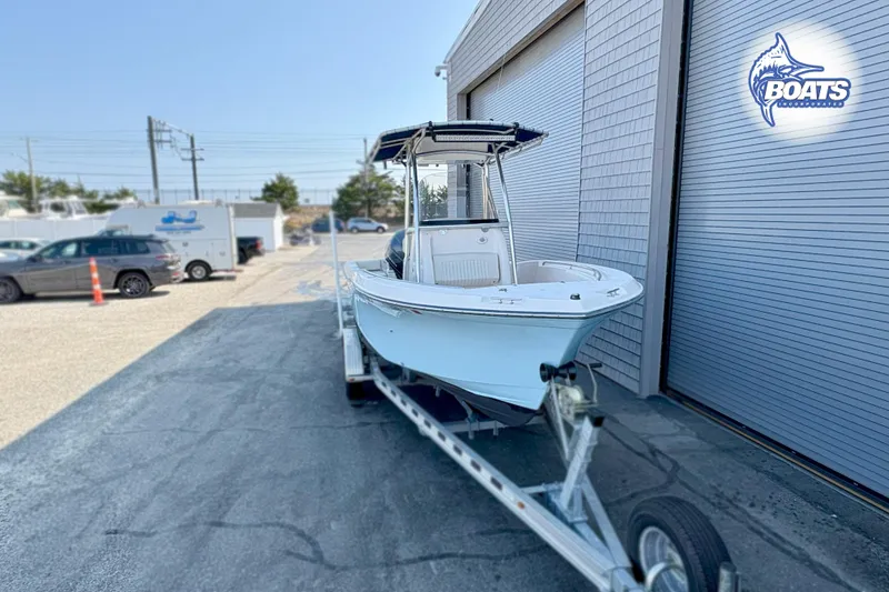 Slide: The Image of 2013 Grady-White Fisherman 209 boat on trailer outside a storage facility. - 2