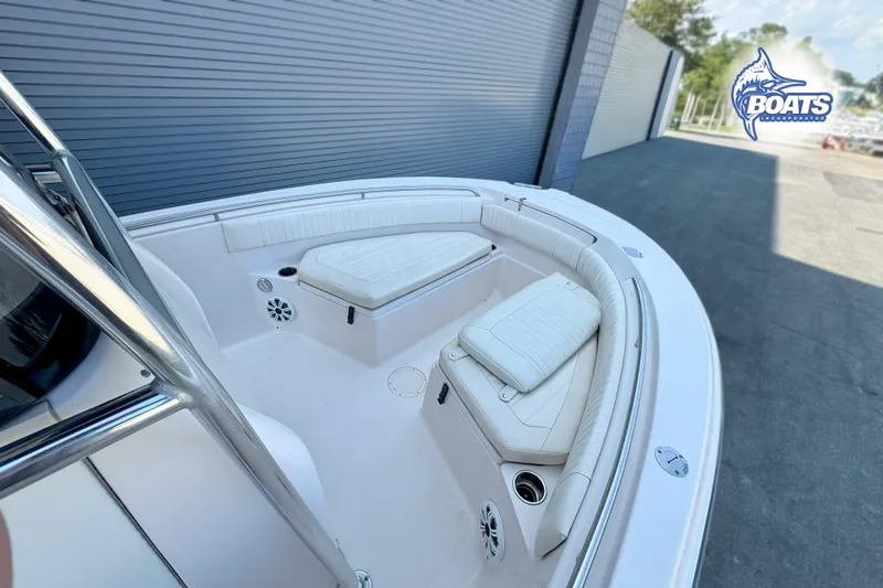 Slide: The Image of 2013 Grady-White Fisherman 209 boat interior with cushioned seating and speakers. - 4