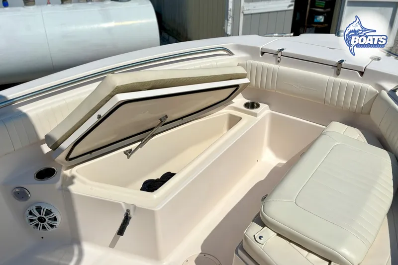 Slide: The Image of 2013 Grady-White Fisherman 209 boat interior with open storage compartment and seating. - 5
