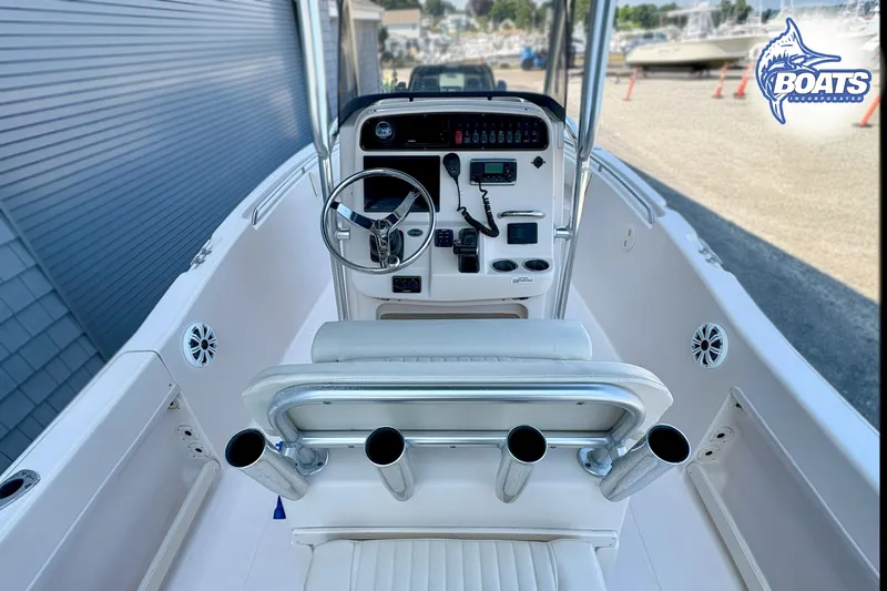 Slide: The Image of 2013 Grady-White Fisherman 209 boat cockpit with steering wheel and controls. - 6