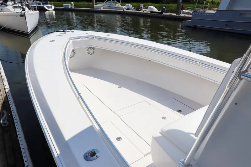 Slide: The Image of 2008 Contender 31 Tournament boat docked, showcasing spacious deck and sleek design. - 11